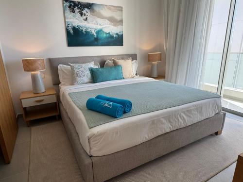 En eller flere senge i et værelse på Naccara Luxe Apartment Grand Baie Beachside