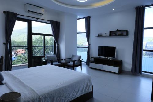 Ένα ή περισσότερα κρεβάτια σε δωμάτιο στο Nam Hai Con Dao Hotel