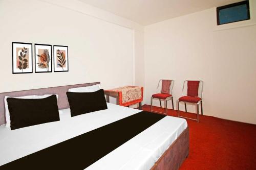 Postel nebo postele na pokoji v ubytování Hotel O by OYO Kalka