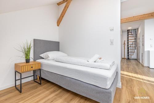 En eller flere senge i et værelse på SMS-Homes I Auszeit am See #2