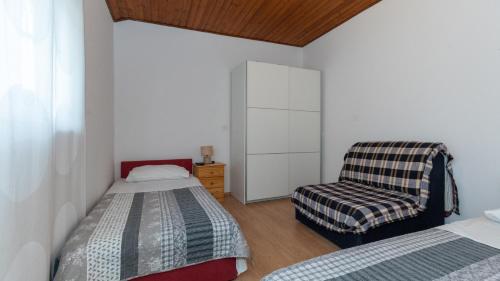 En eller flere senge i et værelse på Apartman Dubravka by Villas Guide