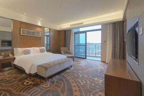 Ένα ή περισσότερα κρεβάτια σε δωμάτιο στο Wuhan Gleetour Hotel
