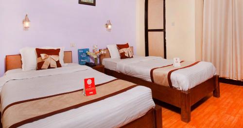 En eller flere senge i et værelse på River Fun Beach Resort