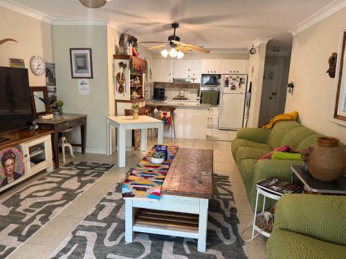 a living room with a couch and a table at NEWTOWN - HEART OF - Bohemian Creative Space in Sydney