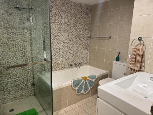 a bathroom with a shower and a sink at NEWTOWN - HEART OF - Bohemian Creative Space in Sydney