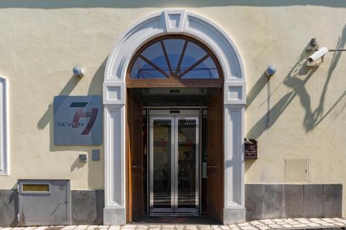 an entrance to a building with a glass door at Seven Hostel & Rooms in Sant'Agnello