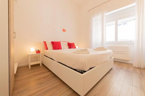 Postel nebo postele na pokoji v ubytování L'Ormeggio