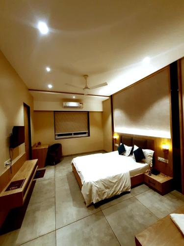 Postel nebo postele na pokoji v ubytování Hotel Ujala Prime