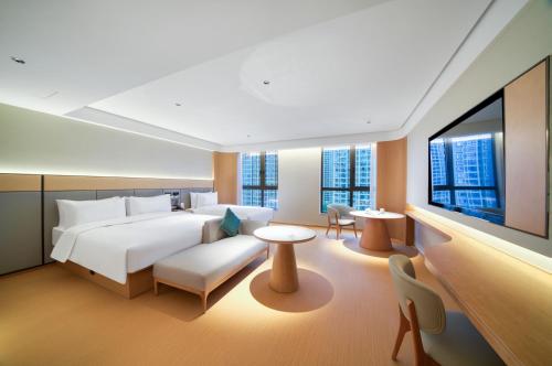 Postel nebo postele na pokoji v ubytování JI Hotel Hangzhou Xiaoshan MixC