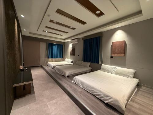 Ένα ή περισσότερα κρεβάτια σε δωμάτιο στο 尹居 包棟民宿