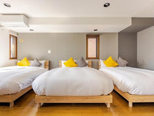 Ένα ή περισσότερα κρεβάτια σε δωμάτιο στο LIT’S INN Sapporo