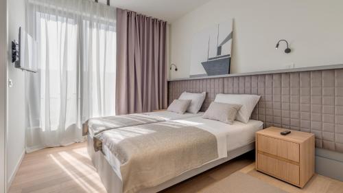 En eller flere senge i et værelse på Villa Sunray by Villas Guide