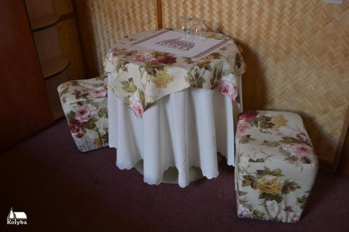 a table with a table cloth with flowers on it at Zakarpatska Kolyba in Odesa