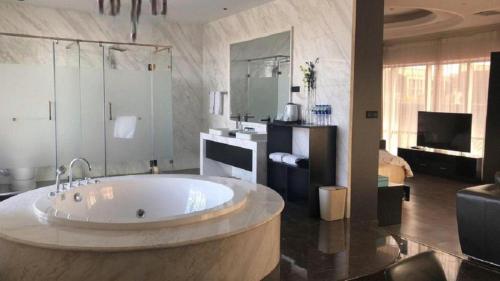 TV a/nebo společenská místnost v ubytování Xana Hotelle XiAn Gig Wild Goose Pagoda Branch