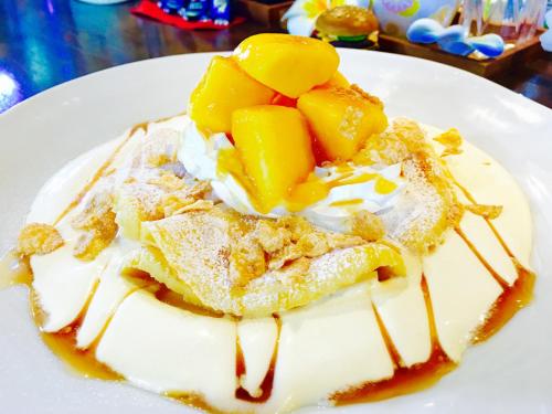 a white dessert with fruit on a white plate at Ma-Blue Garden House in Motobu