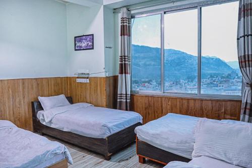 Giường trong phòng chung tại Hotel Bandana