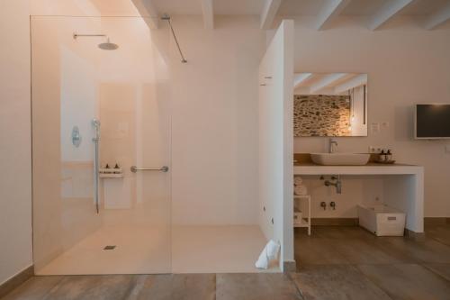 a bathroom with a shower and a sink at Agroturismo Son Vives Menorca - Adults Only in Ferreries