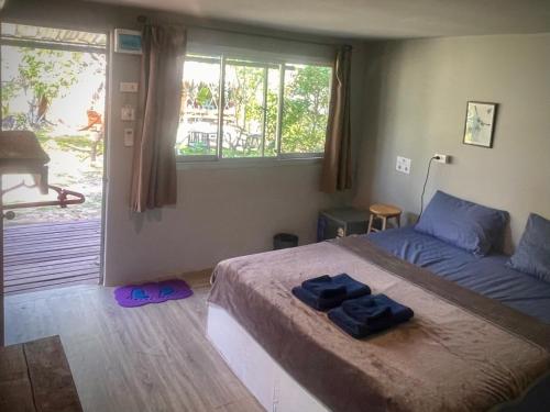 Ένα ή περισσότερα κρεβάτια σε δωμάτιο στο Ozone Beach House