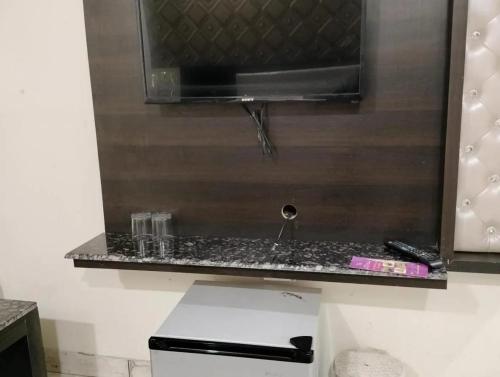 a black counter top with a sink in a bathroom at Hotel Ravi Residency in Jalandhar