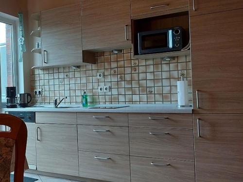 Köök või kööginurk majutusasutuses Feriendomizil Wattwurm Paul