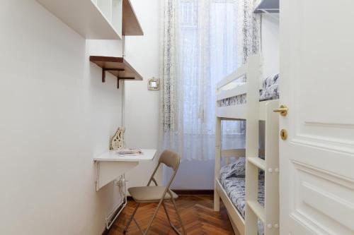 En eller flere senge i et værelse på Elegante appartamento d'epoca nel centro di Trieste