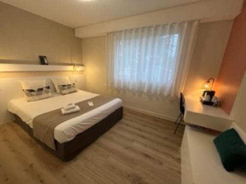 Llit o llits en una habitació de L'Espadon