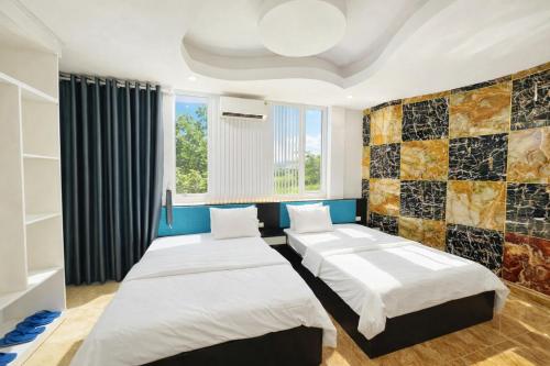 En eller flere senge i et værelse på Hưng Phú 3 Hotel