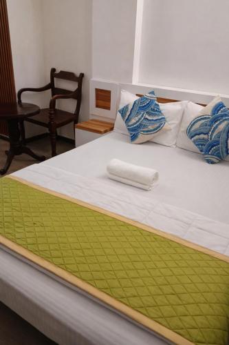 Postel nebo postele na pokoji v ubytování Male City Stay