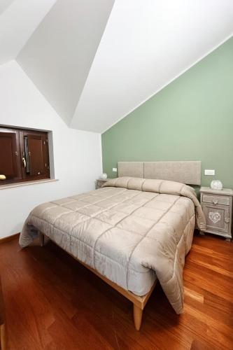 a bedroom with a large bed in a room at Le Tre Civette in Alfedena