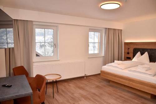 Postel nebo postele na pokoji v ubytování Katschbergstub'n