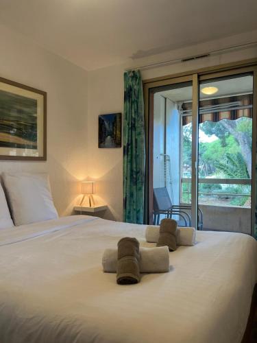 En eller flere senge i et værelse på Pied à terre - Port de Hyères