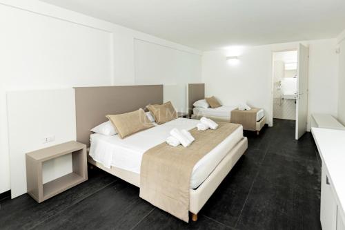 Postel nebo postele na pokoji v ubytování Ungaretti Resort