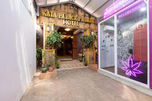 an entrance to a kka palapa palace hotel at Kata Palace Phuket Hotel in Kata Beach