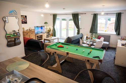 a living room with a pool table at Pines Villas 1, Three Spacious 3BR Homes, Perfect for Groups in Boughton