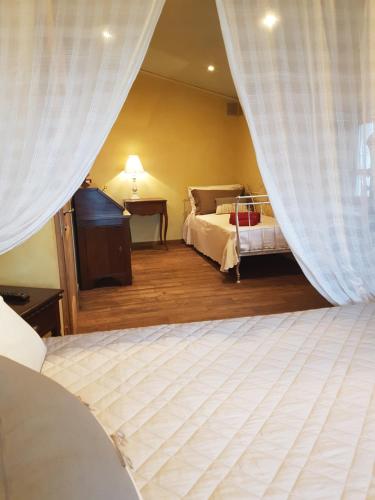 Ένα ή περισσότερα κρεβάτια σε δωμάτιο στο Villa Desideri Agriturismo Dinoabbo