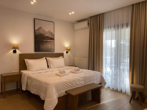 Ένα ή περισσότερα κρεβάτια σε δωμάτιο στο Λίθος