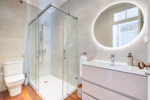a bathroom with a shower and a toilet and a sink at Quintinha de São Martinho - Villa & Lux in Funchal