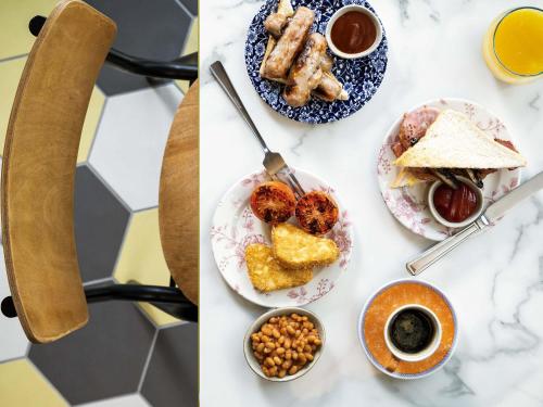 a table topped with plates of food and cups of coffee at ibis Bridgwater, M5 Jct23 in Bridgwater
