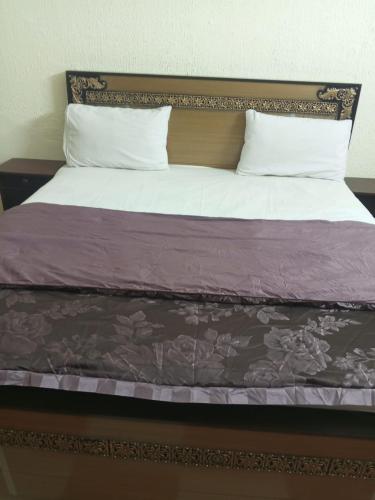 Giường trong phòng chung tại Hotel Eleven J