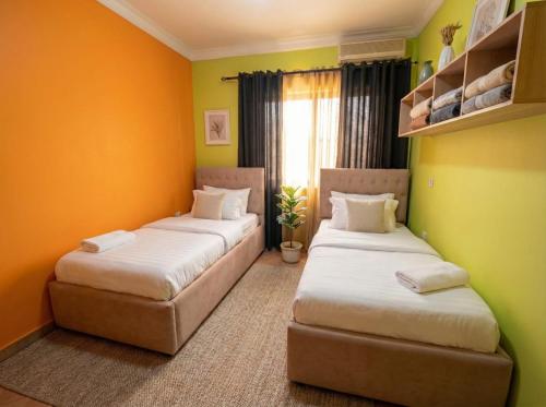 Tempat tidur dalam kamar di Alba Rooms