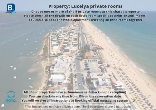 a map of a beach with a bunch of buildings at Blife Lucelya private rooms at Faro beach in Faro