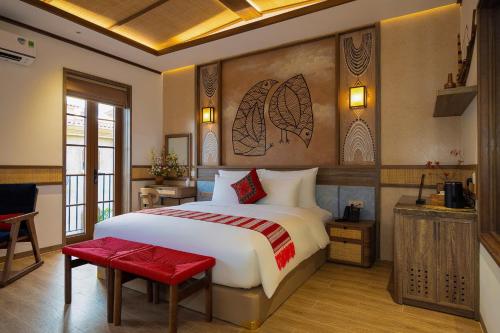 En eller flere senge i et værelse på ZAO Hotel Firework & Sea View