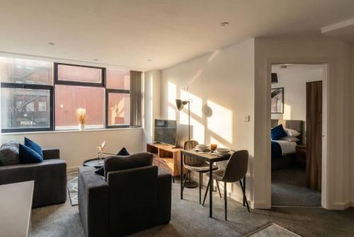 a living room with a couch and a table at Fantastic 1 Bed Central Preston Apartment in Preston