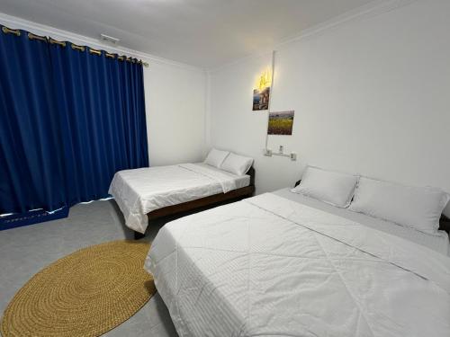 Ένα ή περισσότερα κρεβάτια σε δωμάτιο στο David's Hostel & Restaurant