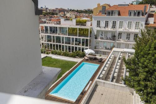 an overhead view of a swimming pool on top of a building at Lagares 74 in Lisbon