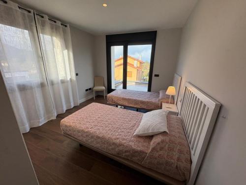 En eller flere senge i et værelse på Chalet La Llavandera