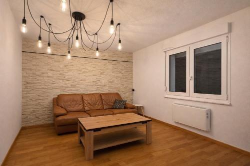 Posezení v ubytování Appartement confortable N1 à Saint-Louis, proche Basel&Allemagne