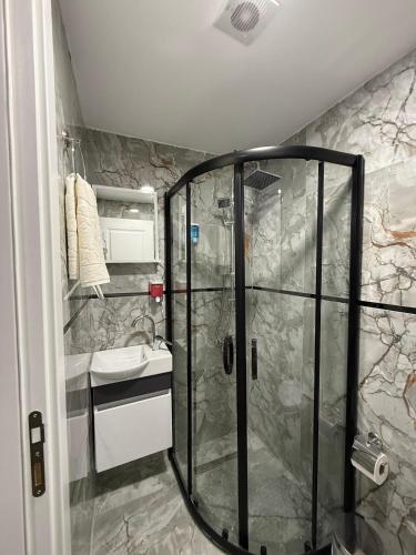 a bathroom with a shower and a sink at Atay Apart in Istanbul