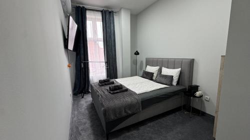 Giường trong phòng chung tại Libero apartmani