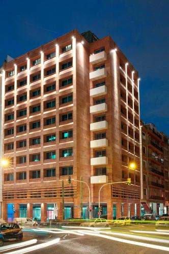 a large building with lights on the side of it at Zeus Essence Athens Central, former Athens Key in Athens